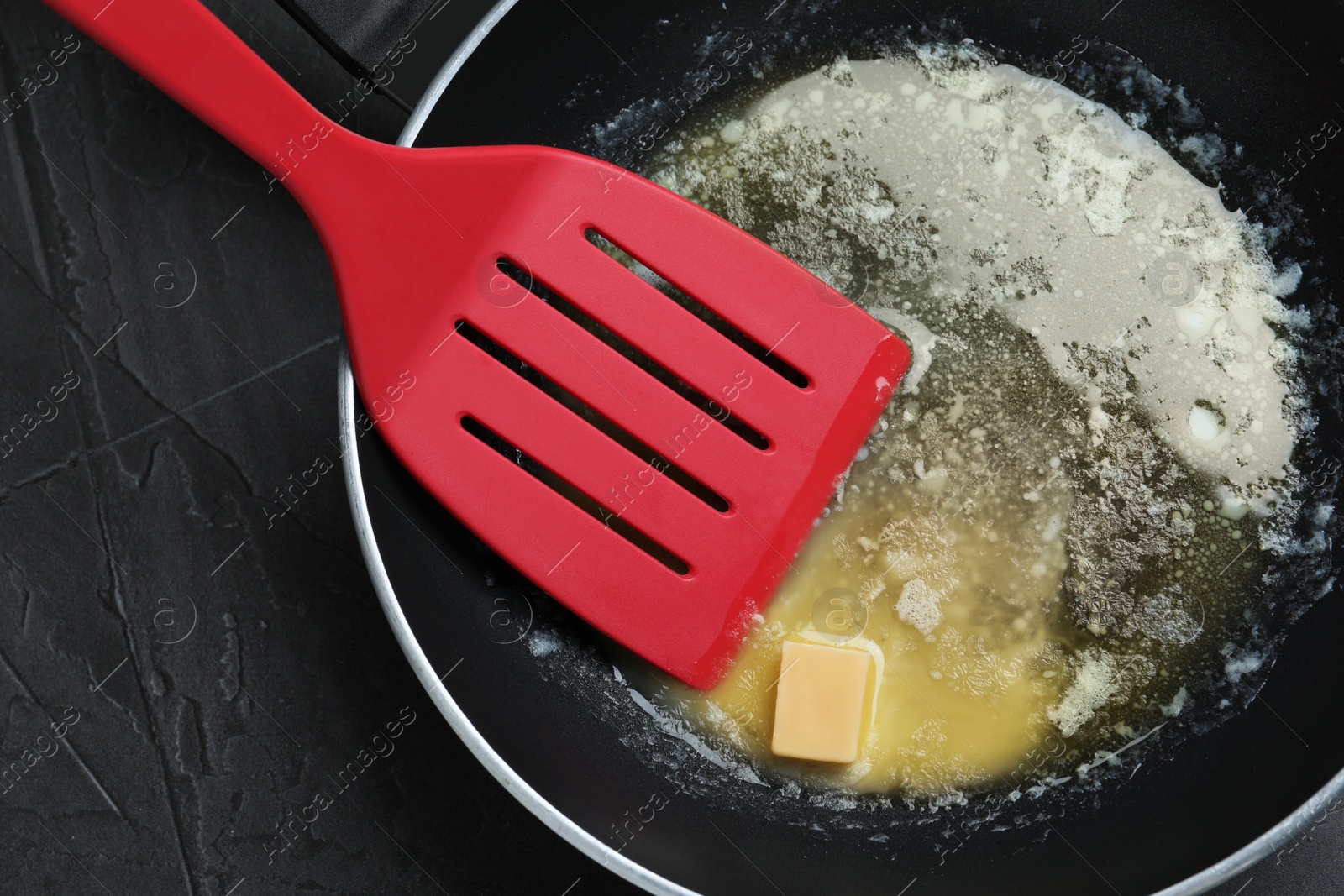 Photo of Melting butter in frying pan, top view