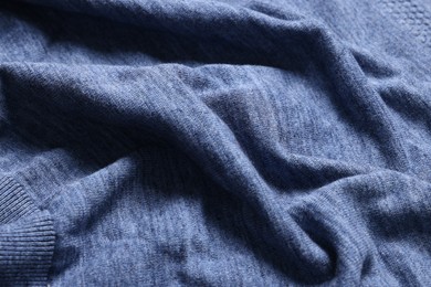 Photo of Texture of blue crumpled fabric as background, closeup