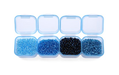 Plastic organizer with different beads isolated on white, above view
