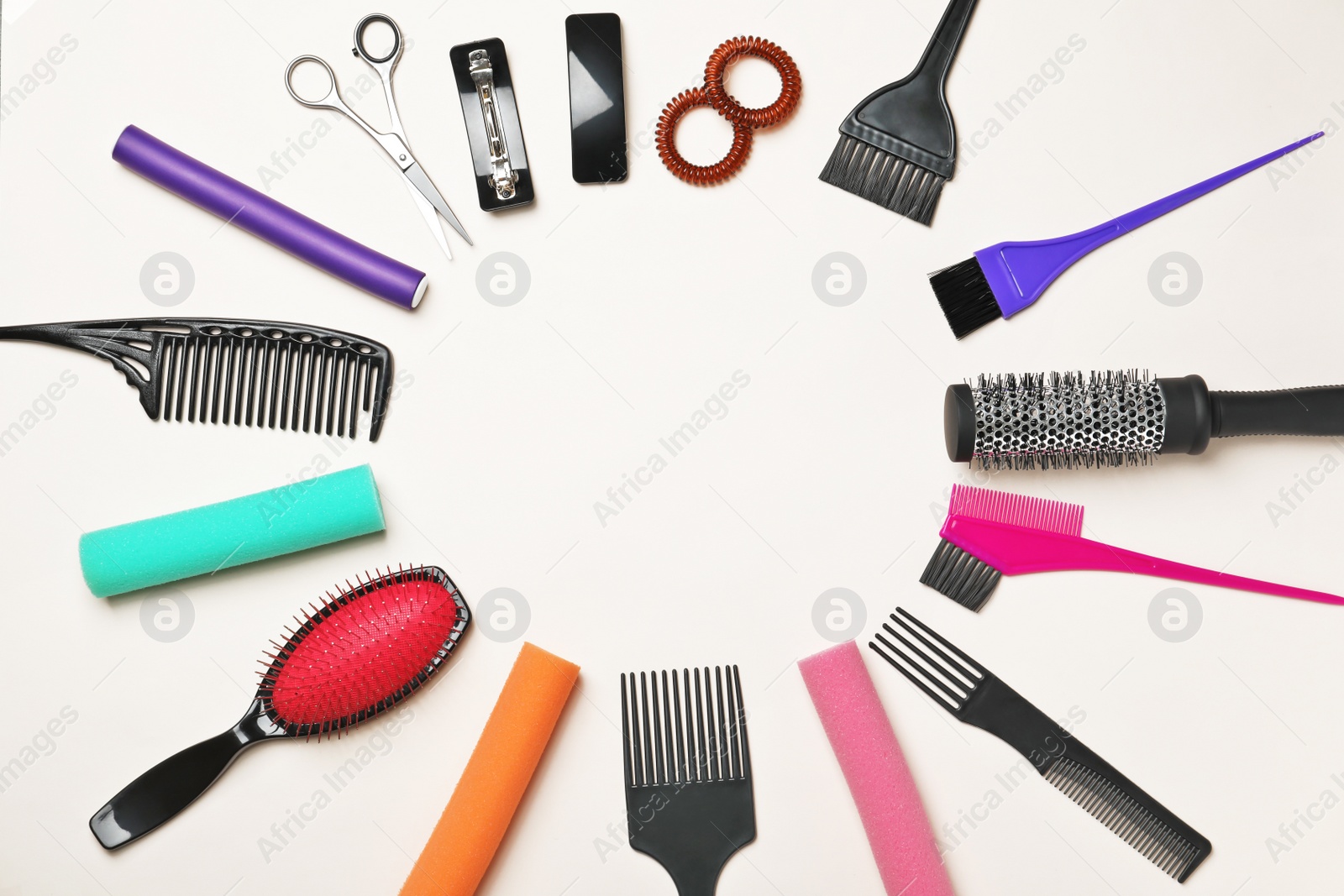 Photo of Professional hairdresser set on color background