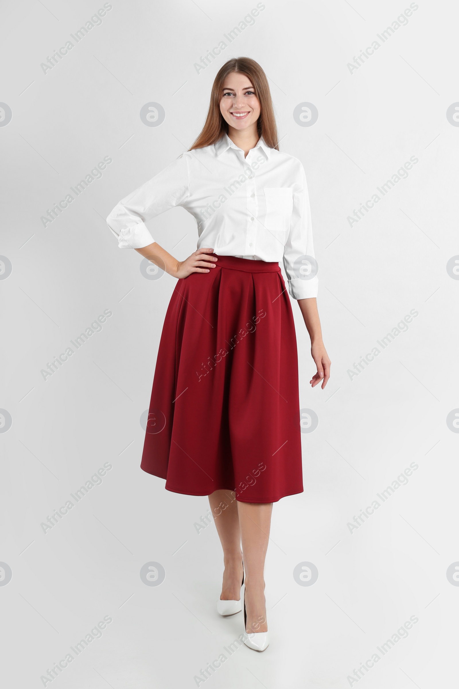 Photo of Full length portrait of beautiful young businesswoman on white background