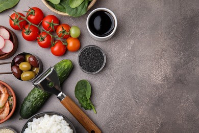 Photo of Ingredients for poke bowl on grey table, flat lay. Space for text