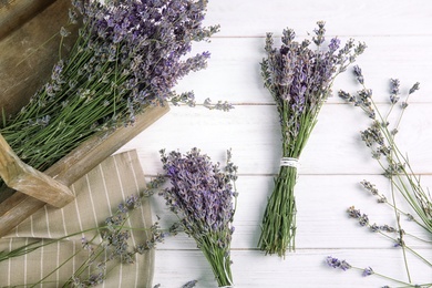 Flat lay composition with lavender flowers on wooden background