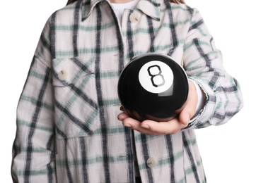 Photo of Woman holding magic eight ball on white background, closeup