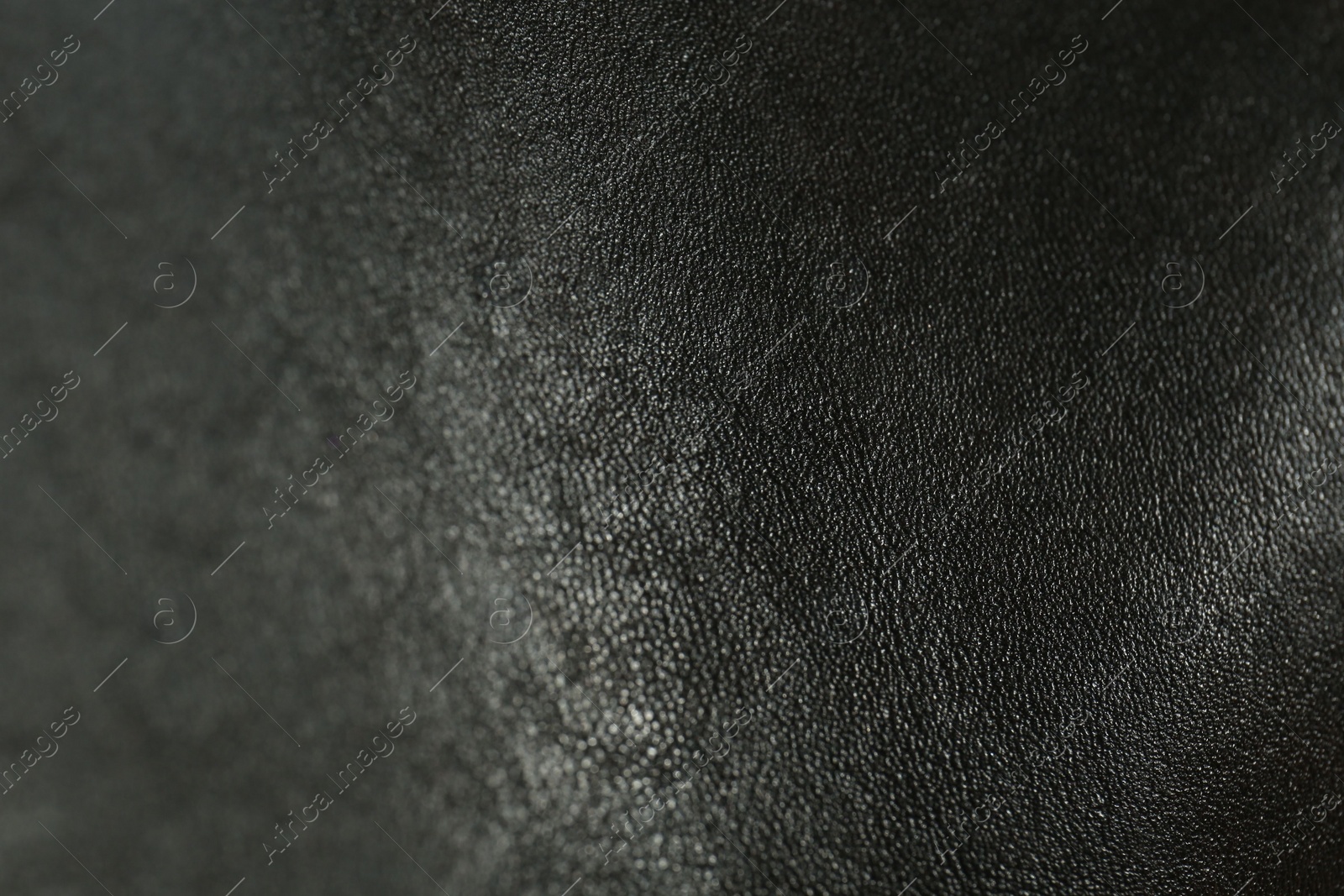 Photo of Texture of black leather as background, closeup