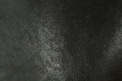 Photo of Texture of black leather as background, closeup