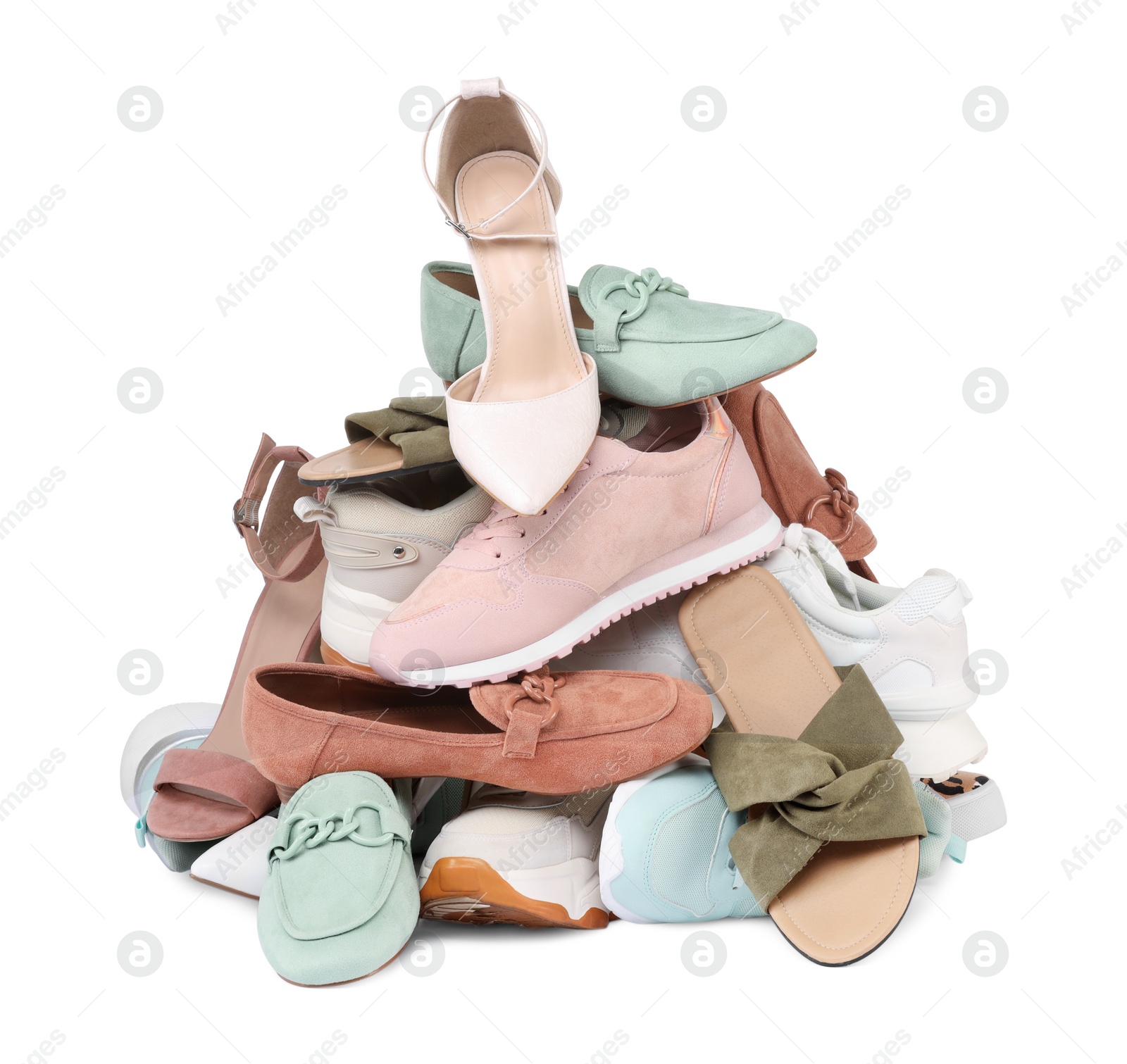 Photo of Pile of different female shoes isolated on white