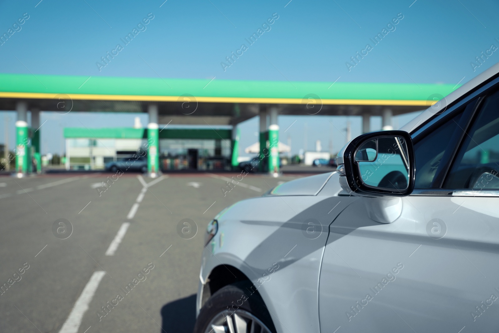 Photo of Modern car driving to gas station, closeup