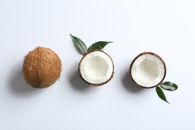 Composition with coconuts on white background, top view