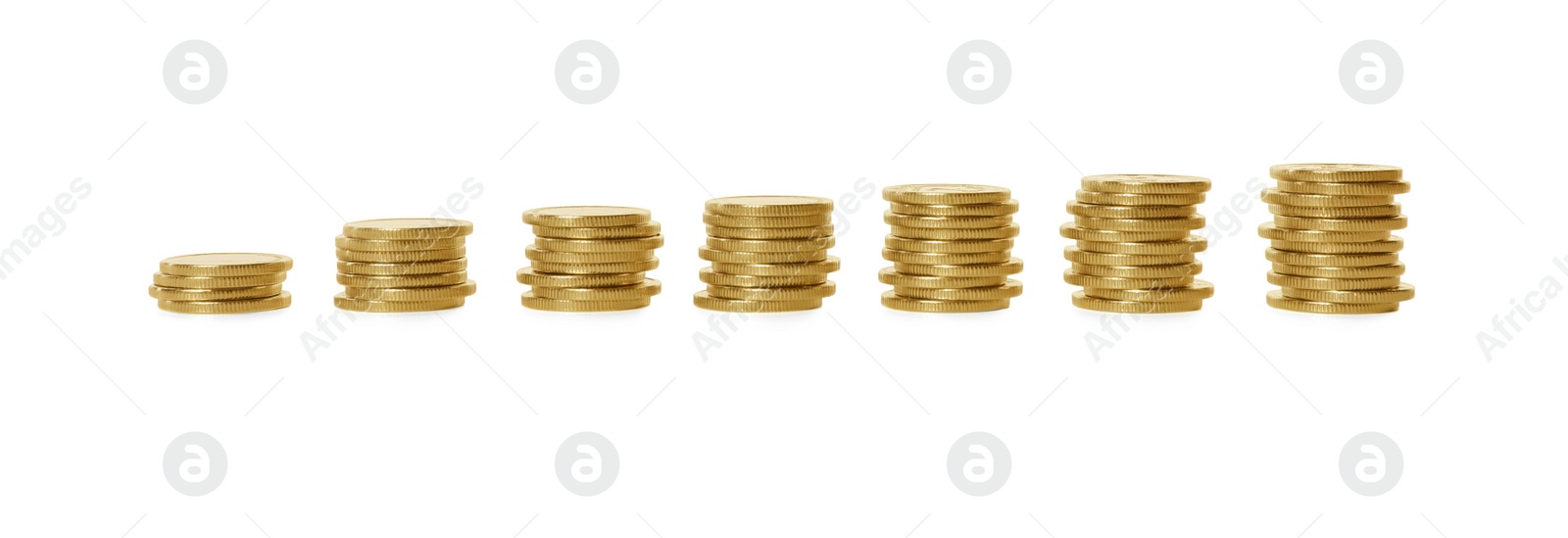 Photo of Stacked coins on white background. Investment concept