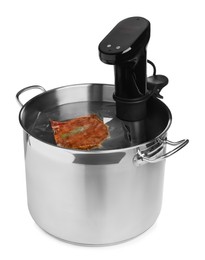 Photo of Thermal immersion circulator and meat in pot on white background. Vacuum packing for sous vide cooking