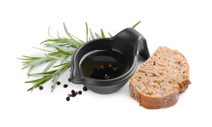 Photo of Saucepan of organic balsamic vinegar with oil, spices and bread slices isolated on white