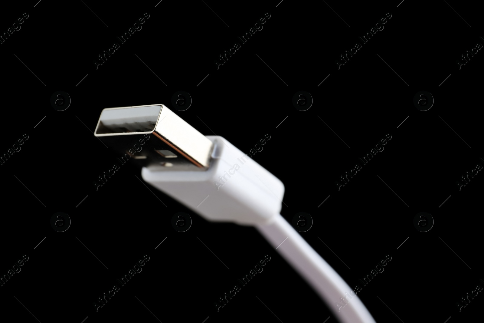 Photo of USB charge cable on black background, closeup. Space for text