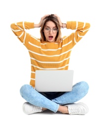 Photo of Shocked young woman in casual outfit with laptop sitting on white background