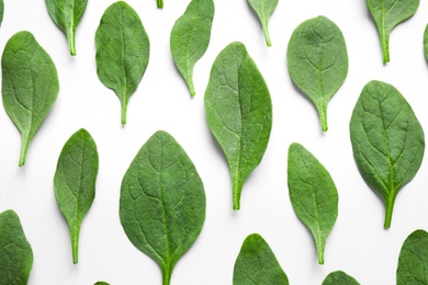 Fresh green healthy spinach leaves on white background, top view