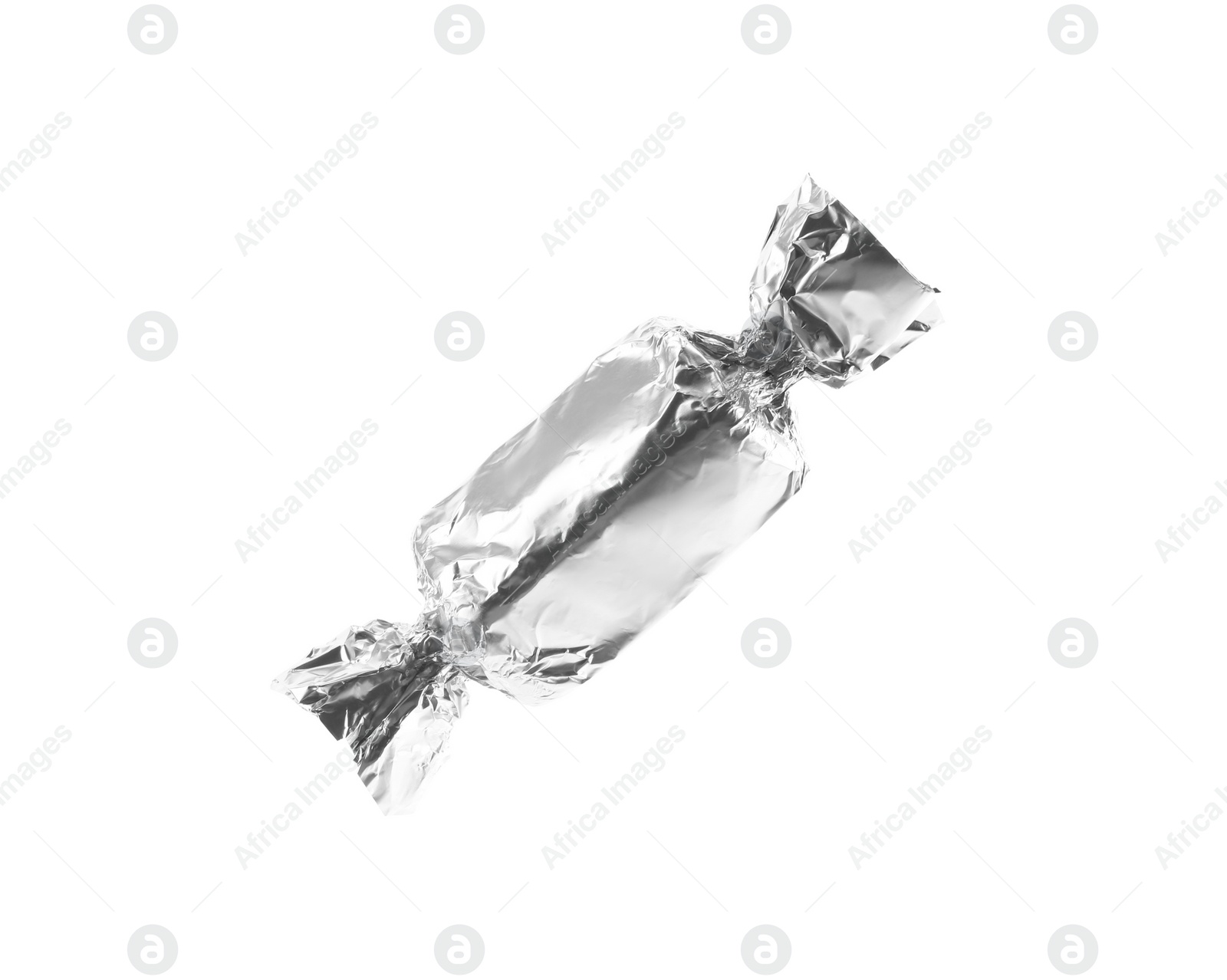 Photo of Tasty candy in silver wrapper isolated on white