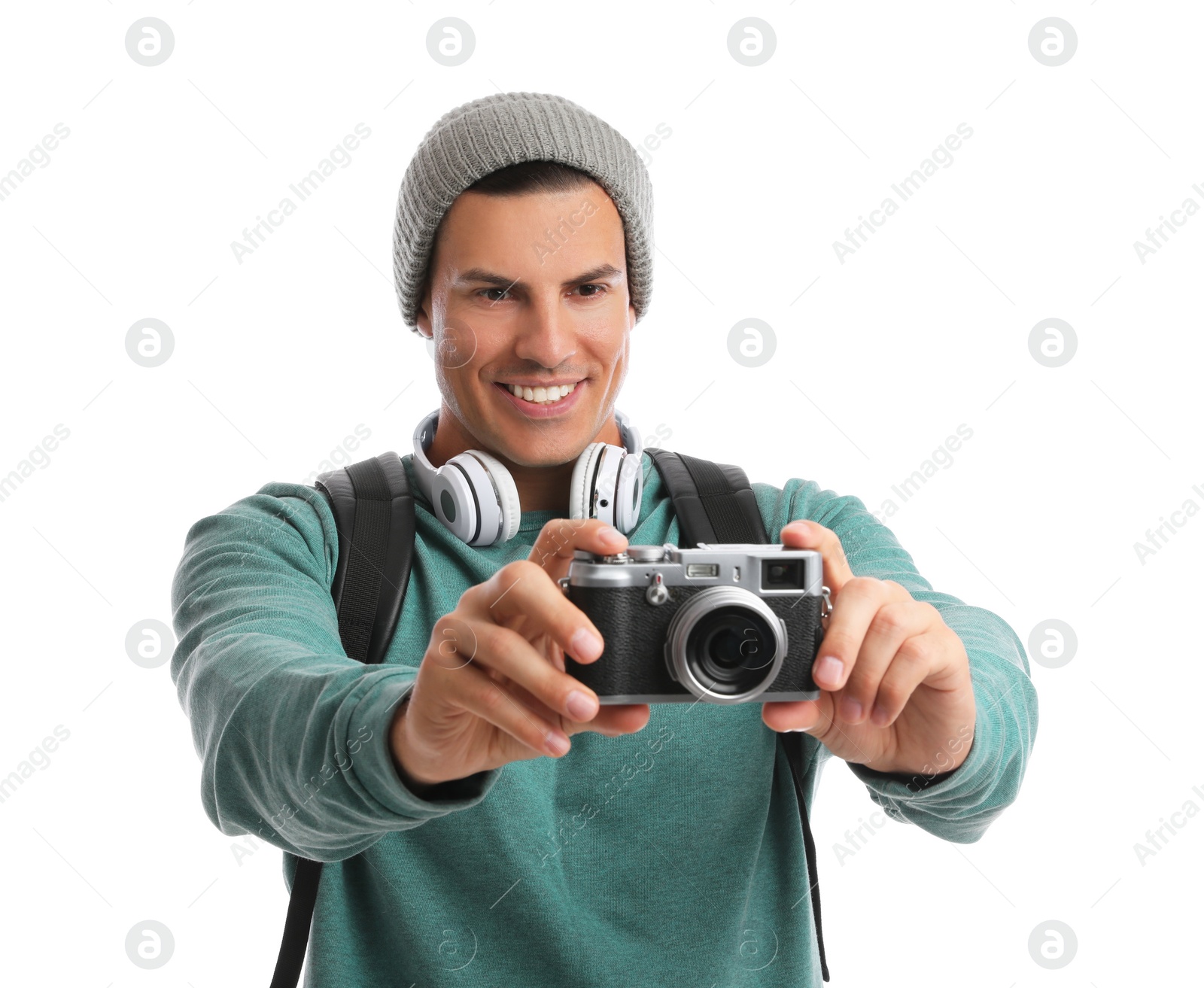 Photo of Man with backpack taking picture on white background. Autumn travel