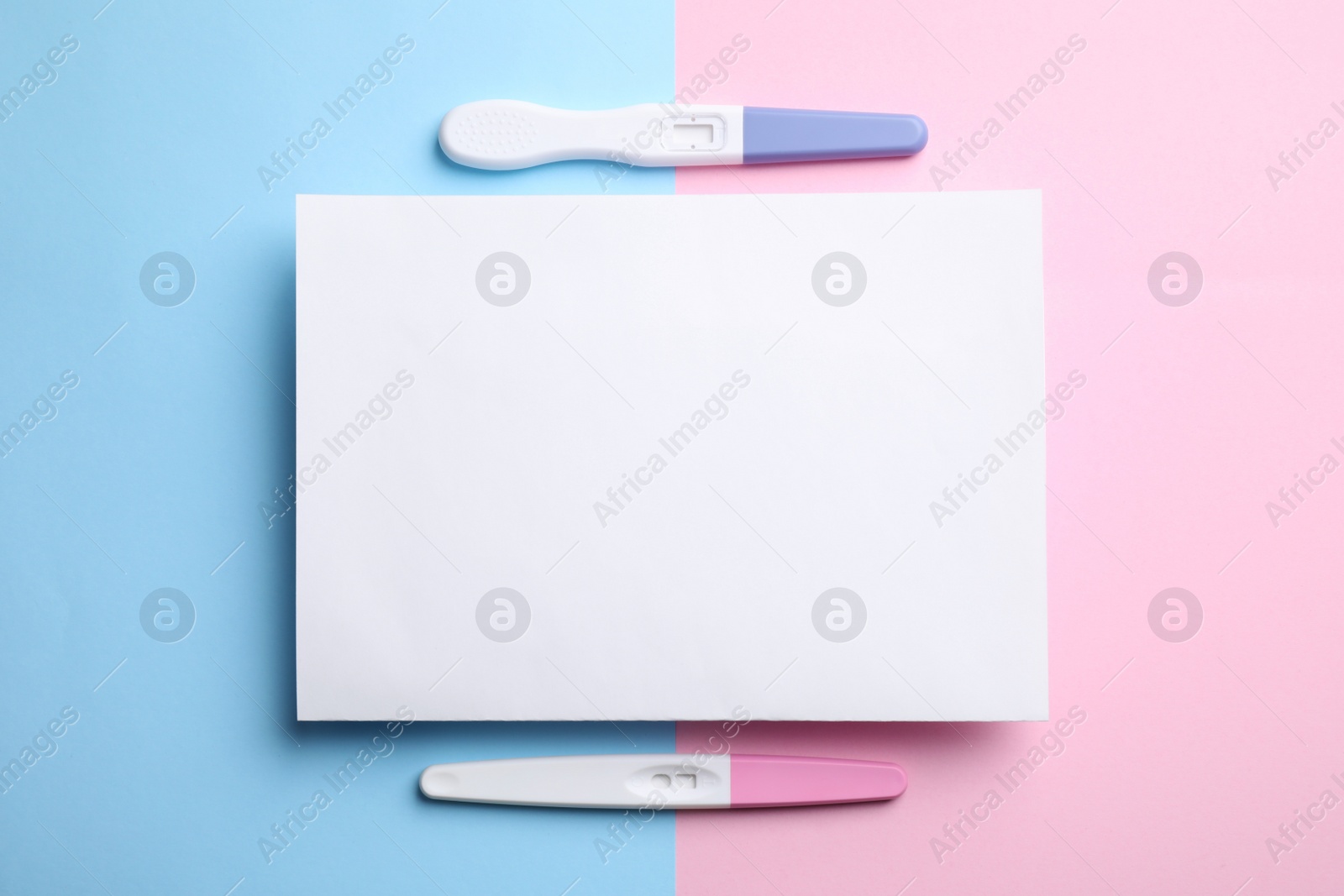 Photo of Different pregnancy tests and blank card on color background, flat lay. Space for text
