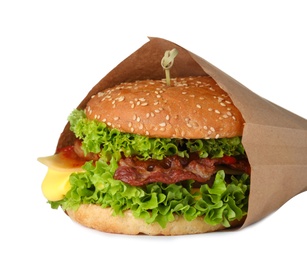 Photo of Fresh burger in craft paper on white background