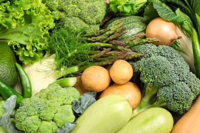 Photo of Different fresh vegetables as background, closeup view