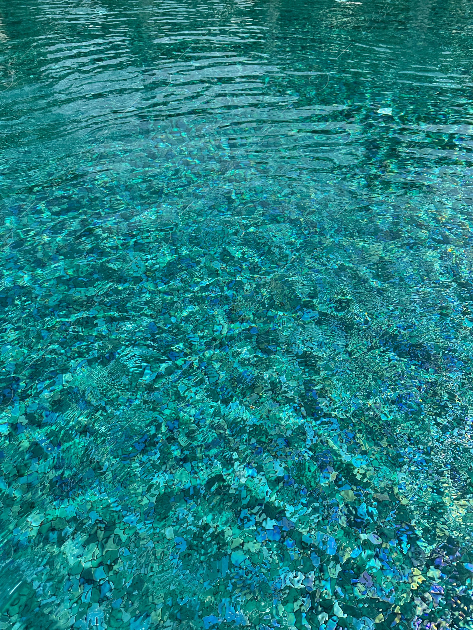 Photo of Clear rippled water in swimming pool outdoors