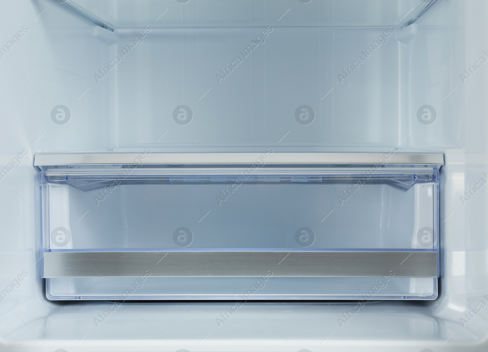 Photo of Shelves of empty modern refrigerator, closeup view