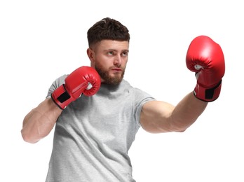 Photo of Man in boxing gloves fighting on white background