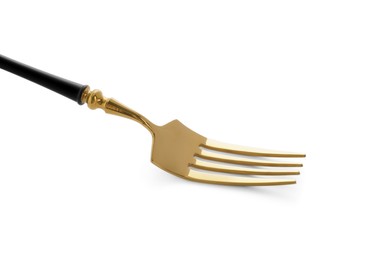 Photo of One shiny golden fork isolated on white