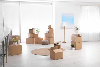 Photo of Room interior with moving boxes and belongings