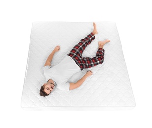 Young man sleeping on mattress against white background, above view