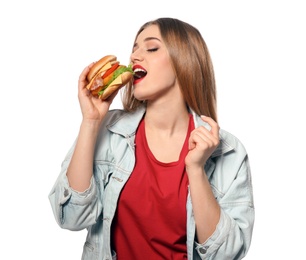 Photo of Pretty woman eating tasty burger isolated on white