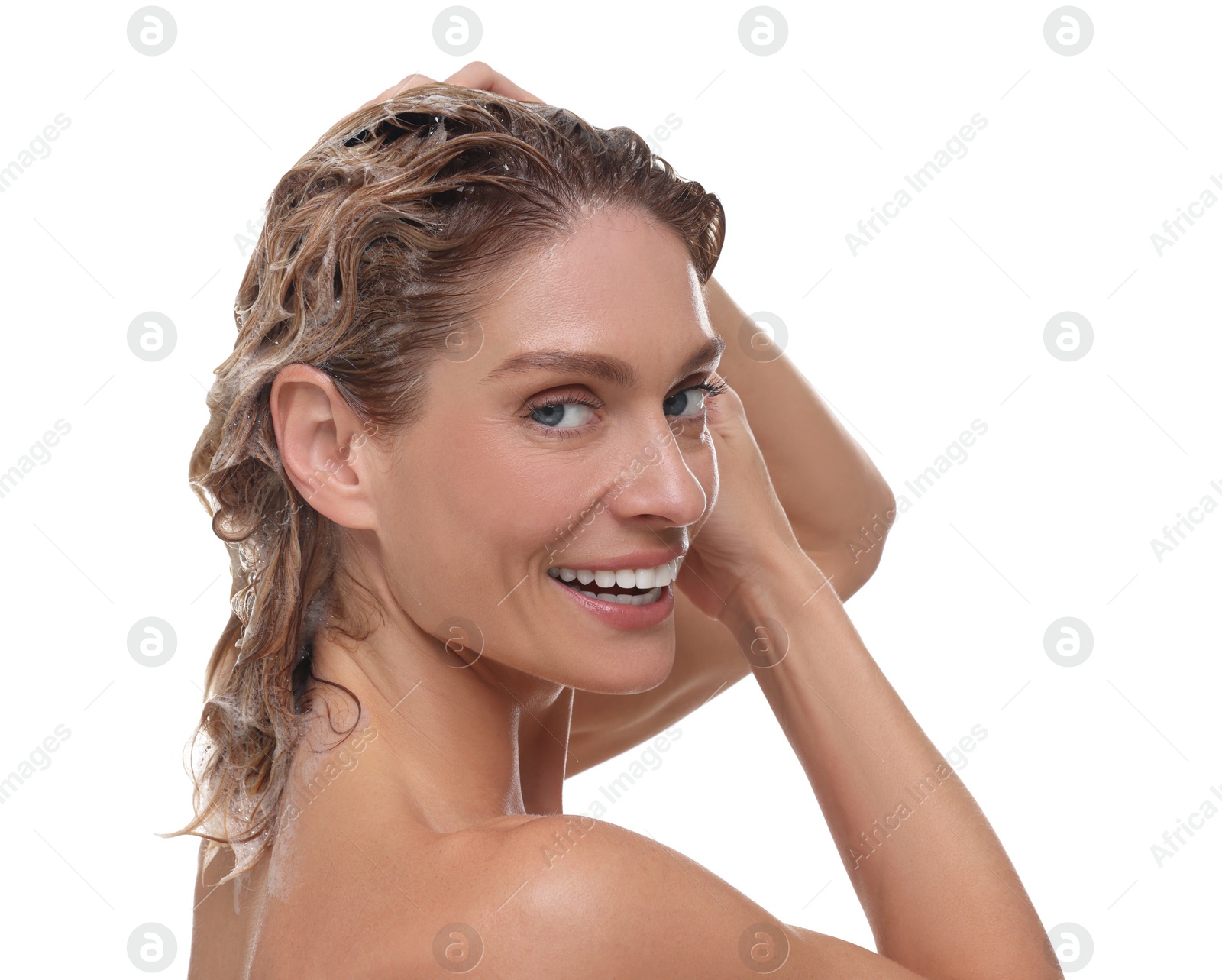 Photo of Beautiful happy woman washing hair on white background