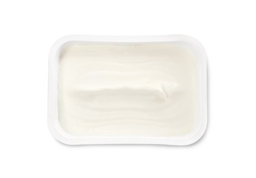Photo of Plastic container of tasty cream cheese isolated on white, top view