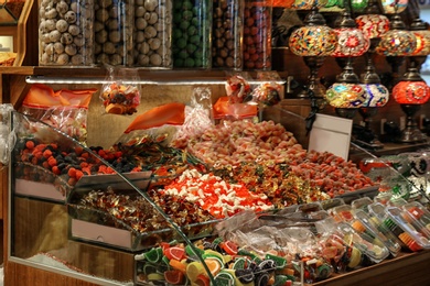 Different kinds of delicious sweets at market