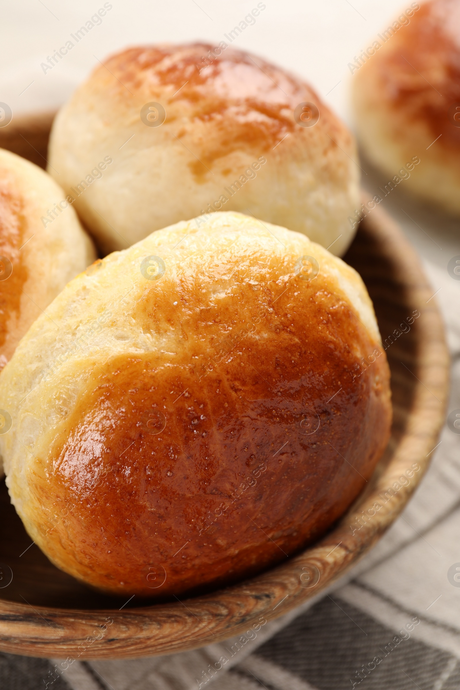 Photo of Freshly baked soda water scones on white wooden table, closeup