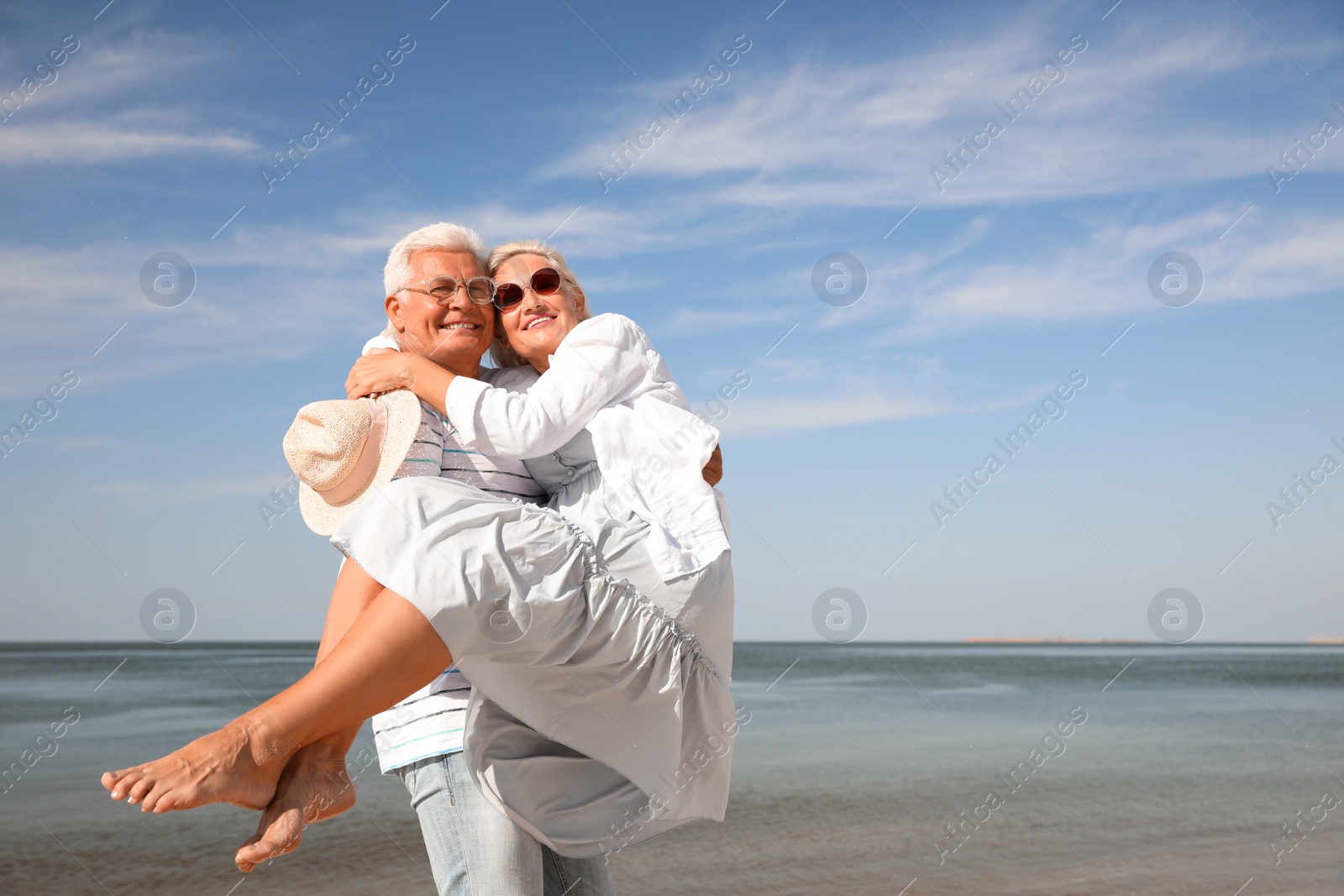 Photo of Mature couple spending time together near sea