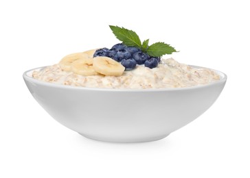 Photo of Tasty boiled oatmeal with banana and blueberries in bowl isolated on white