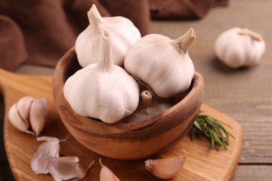 Fresh garlic on wooden table, closeup view