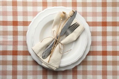 Stylish setting with cutlery and plates on table, top view