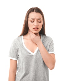 Photo of Young woman suffering from sore throat on white background