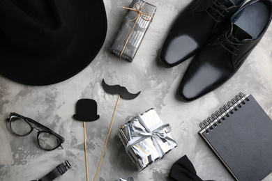 Photo of Flat lay composition male accessories and gift boxes on light grey stone background. Happy Father's day