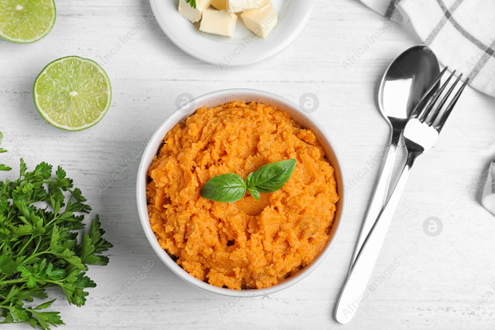 Photo of Flat lay composition with mashed sweet potatoes on wooden background