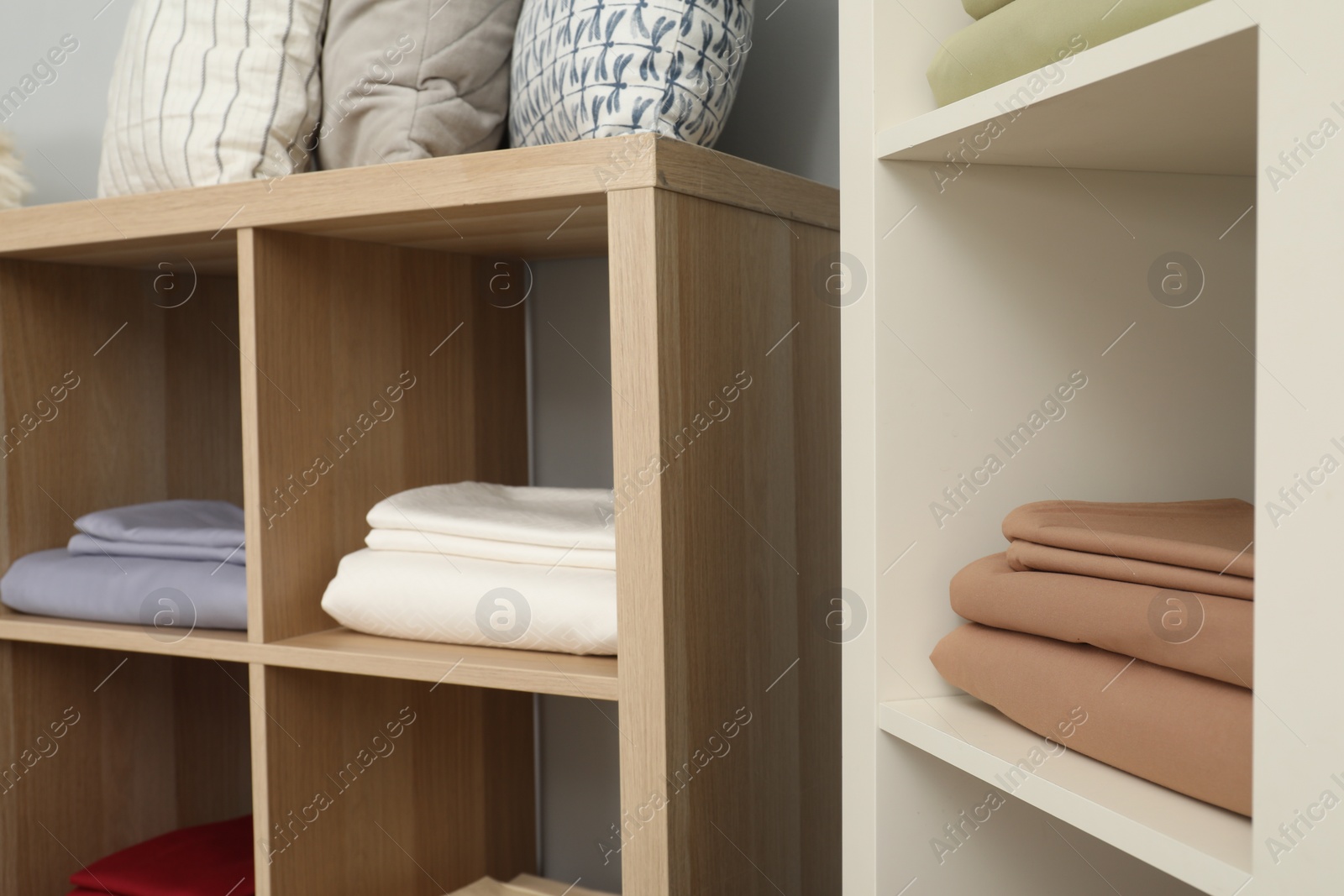 Photo of Different colorful bed linens on display in home textiles store