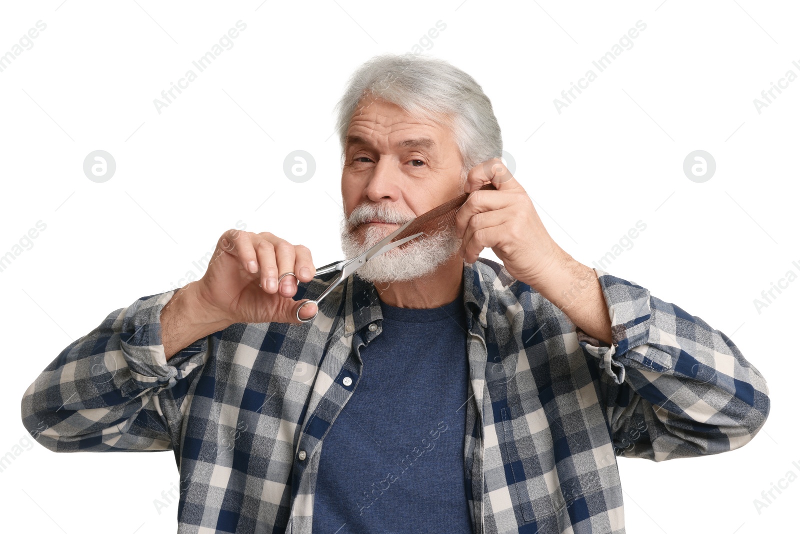 Photo of Senior man trimming beard with scissors on white background