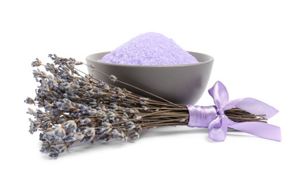 Photo of Violet sea salt in bowl and lavender flowers isolated on white