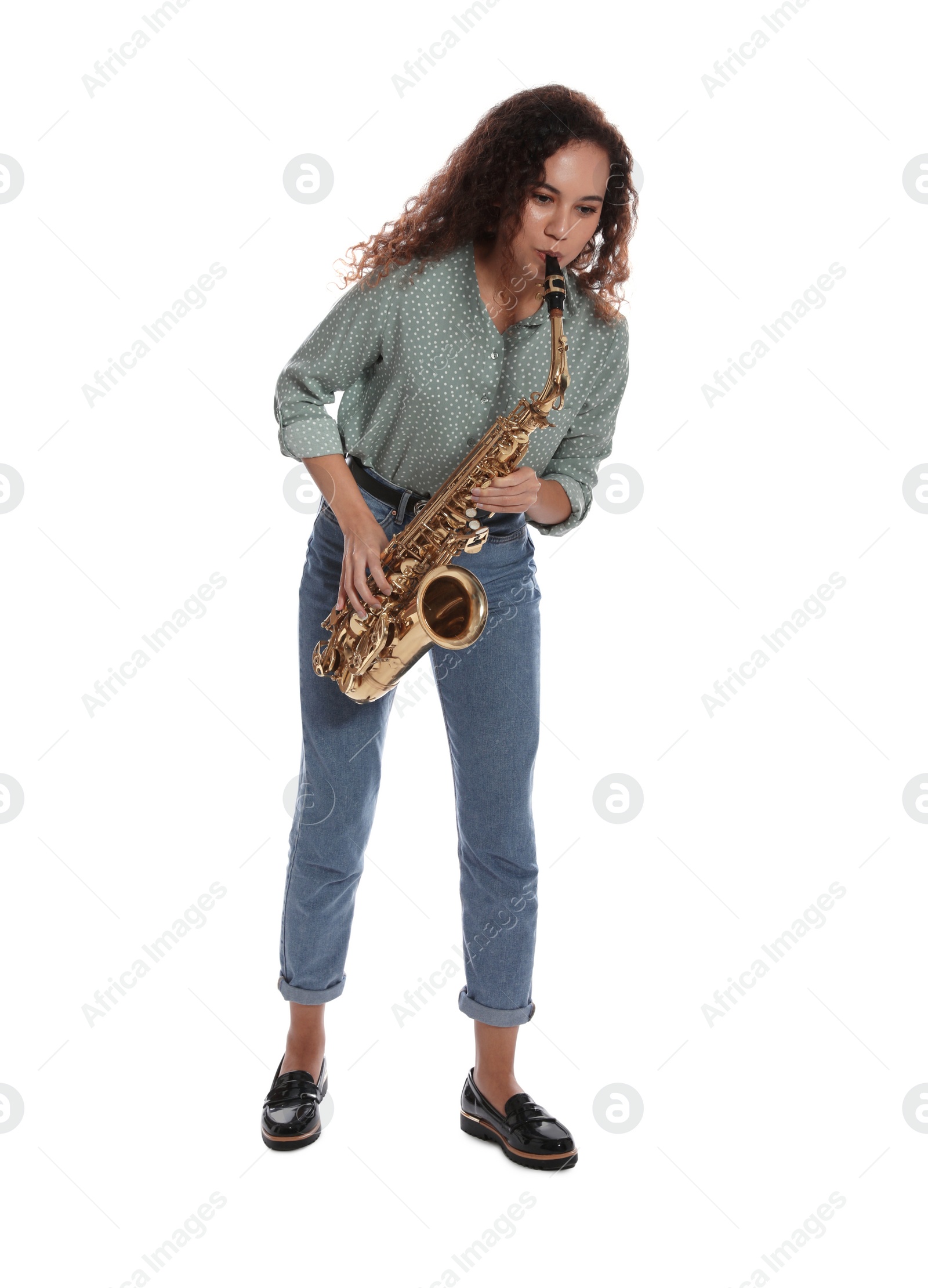 Photo of Beautiful African American woman playing saxophone on white background