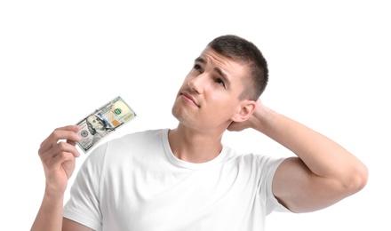 Young man with dollar banknote on white background