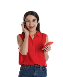 Beautiful young woman listening to music with headphones on white background