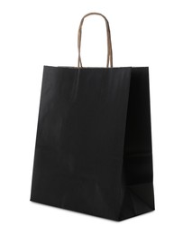 Photo of Blank black paper bag on white background. Space for design