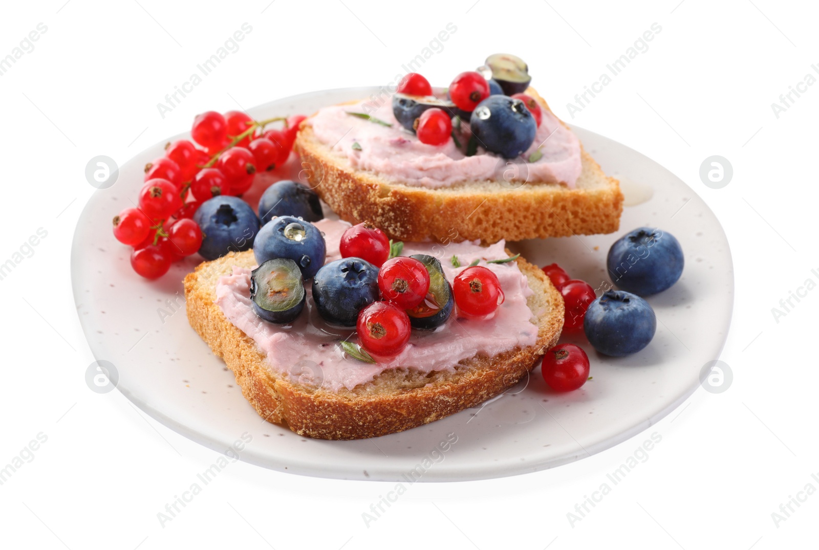 Photo of Tasty sandwiches with cream cheese, blueberries and red currants isolated on white